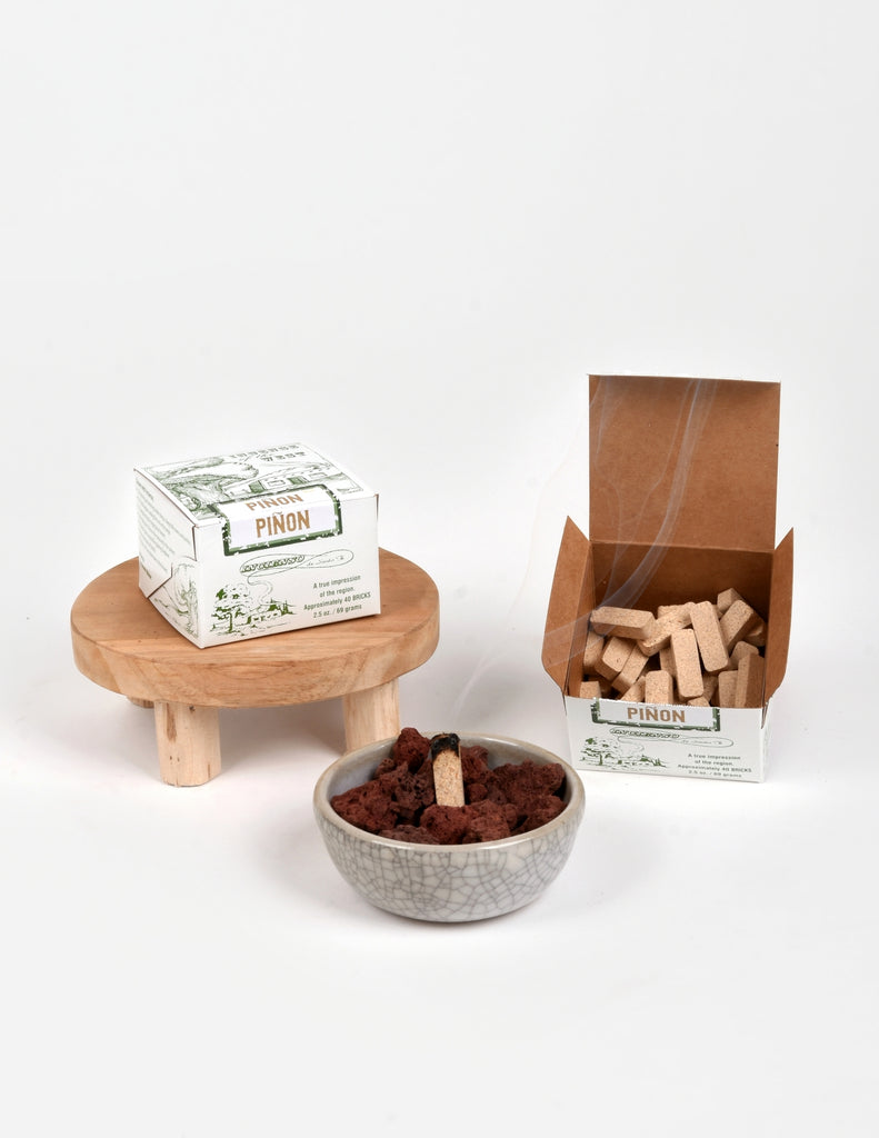 Open Piñon Pine incense box showing light brown pill shaped incense blocks 