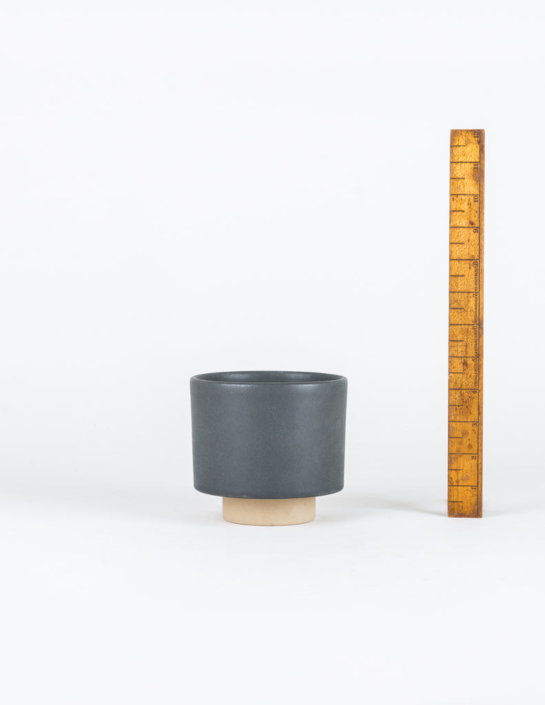 Small Charcoal Leo Planter next to wooden ruler measuring 4.5" height