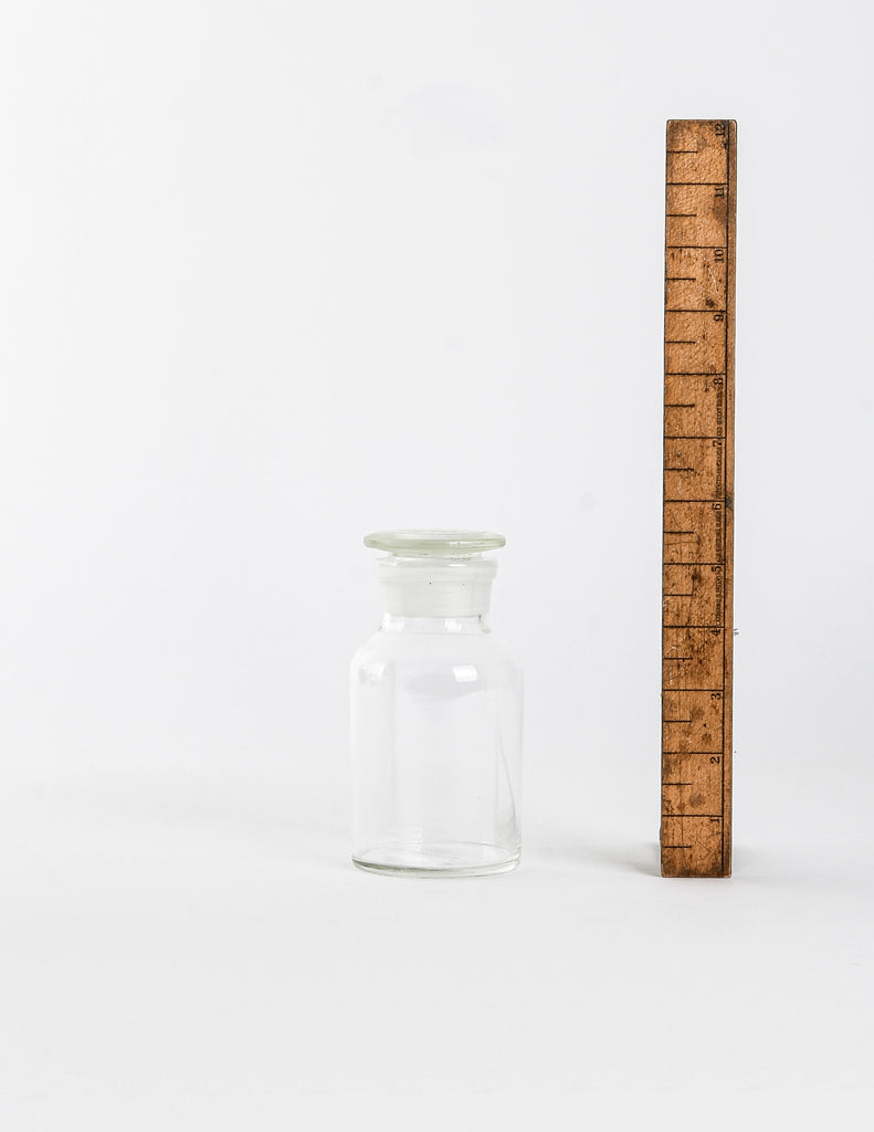Medium Apothecary Jar next to a vertical wooden ruler showing a height of 5.5"